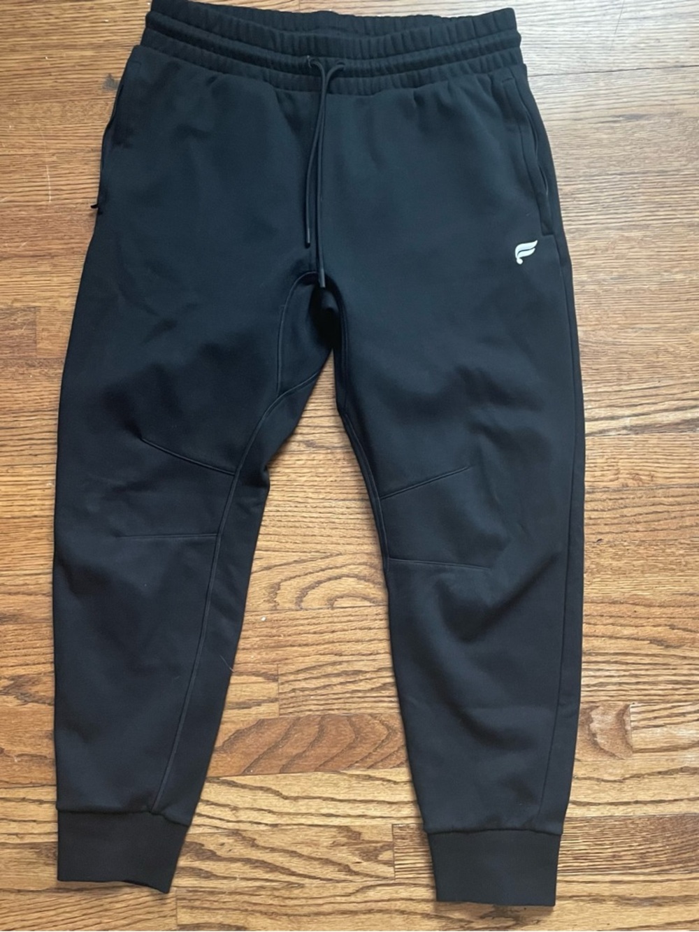 Fabletics Black Jogger Pants Men’s Large with drawstring, zipper pockets, cuffs